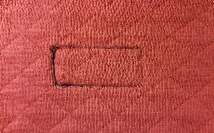 The patch seen from the inside of the shirt The patch seen from the inside of the shirt